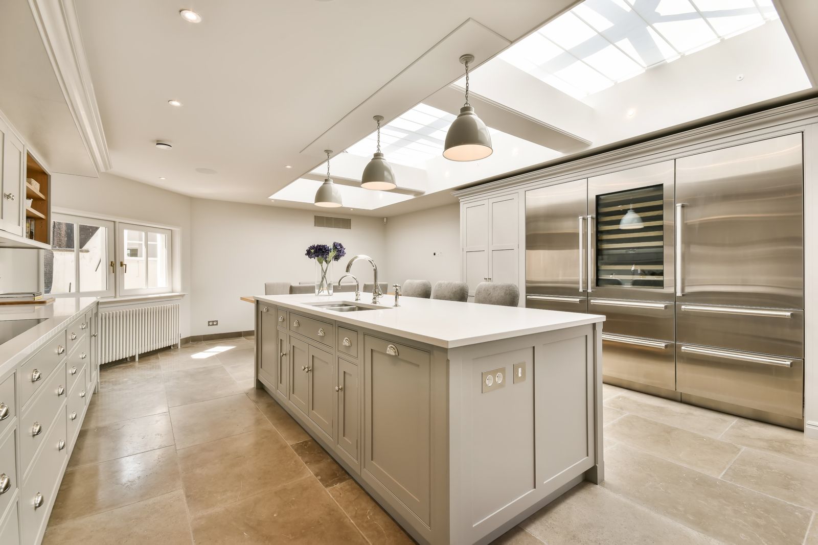 A kitchen extension with a slim-framed glass roof lantern bringing in daylight